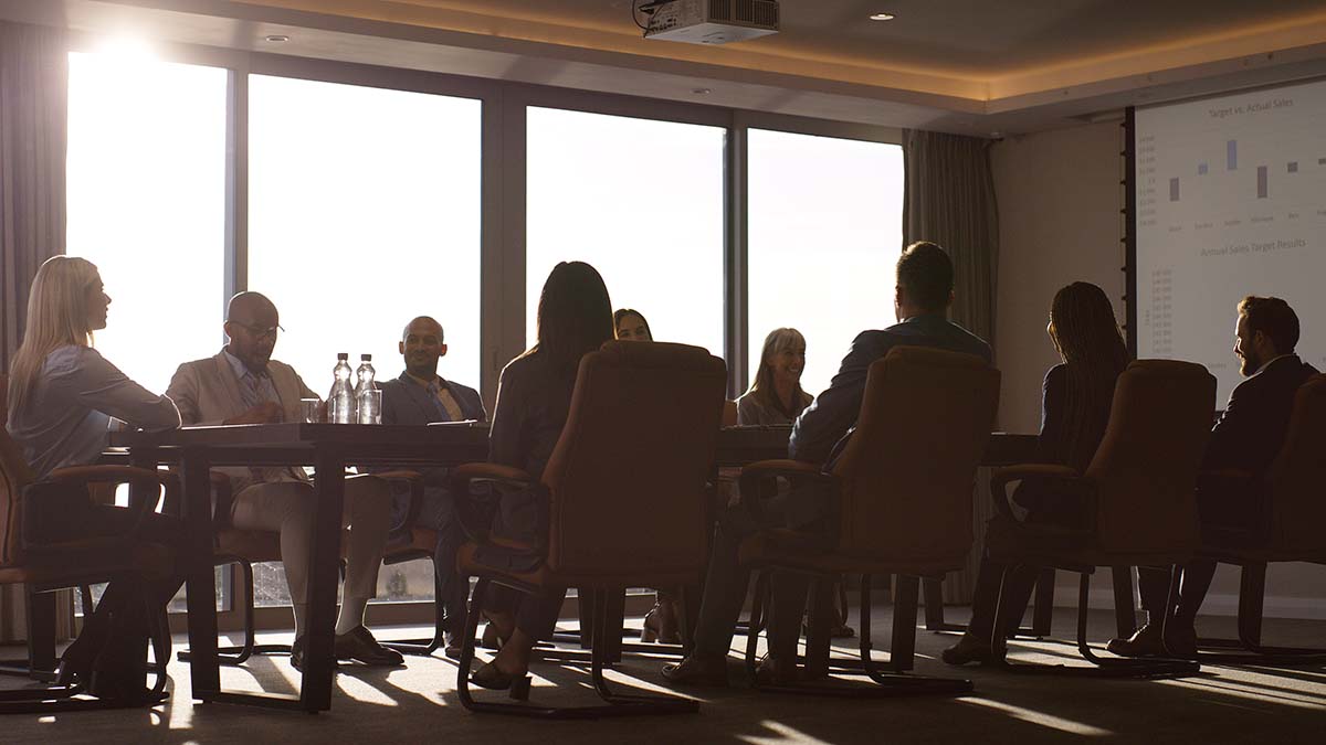 Meet Our Board | Meeting, teamwork and discussion with business people in office for planning, budget review and pitch. Sales projection, partnership and boardroom with employees in agency for proposal and research