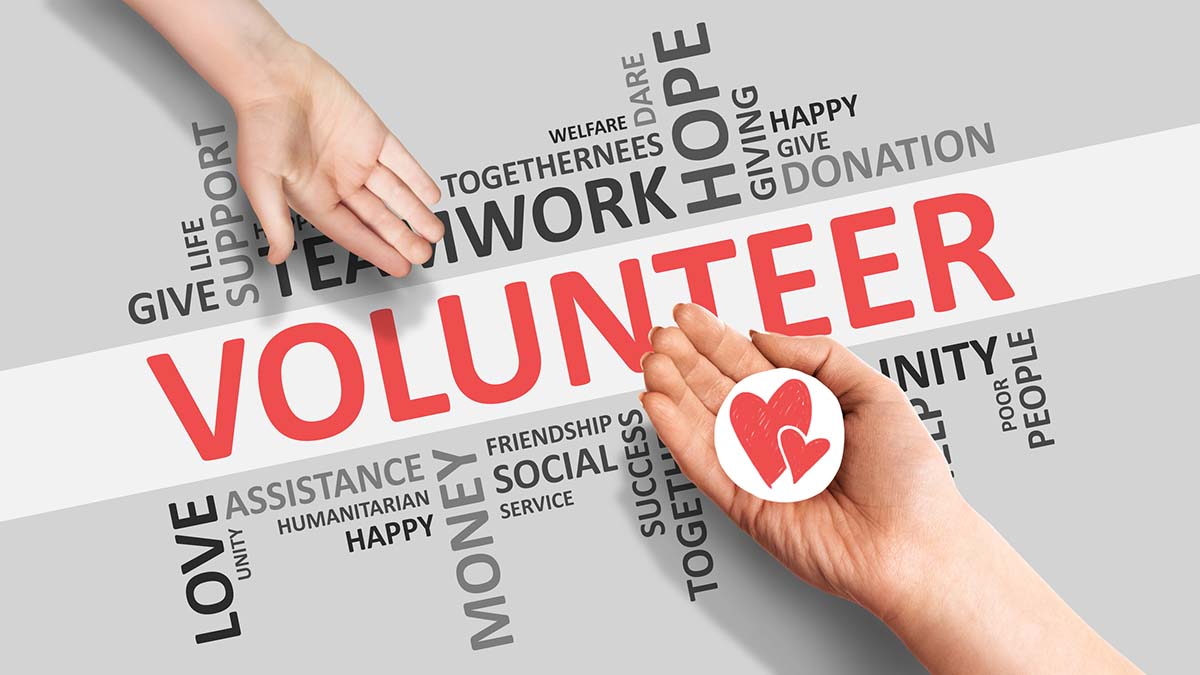 Volunteer | Hands Giving Picture Of Heart On Volunteer Wordcloud Background, Panorama